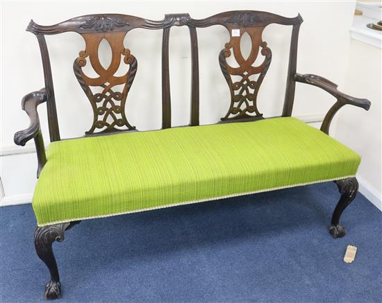 A George III Chippendale style mahogany double chair back sofa, c.1760, W.140cm